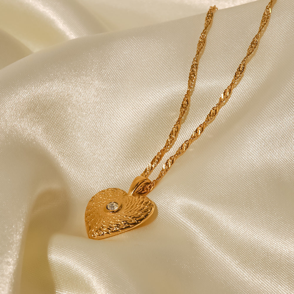 Elisabeth – Gold Necklace Featuring Delicate Symbolic Pendants