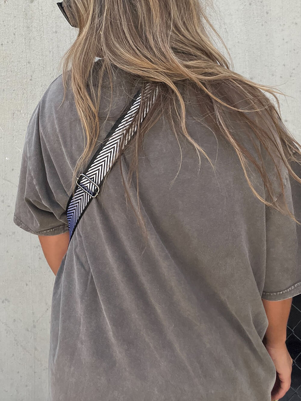 Studded Tassel Crossbody Belt Bag" can be rewritten as "Embellished Tassel Crossbody Belt Bag.