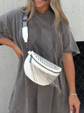 Studded Tassel Crossbody Belt Bag" can be rewritten as "Embellished Tassel Crossbody Belt Bag.