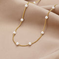 Klara – Double Gold Necklace Featuring Pearl Accents