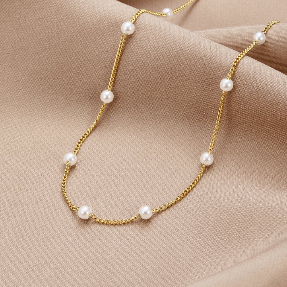 Klara – Double Gold Necklace Featuring Pearl Accents