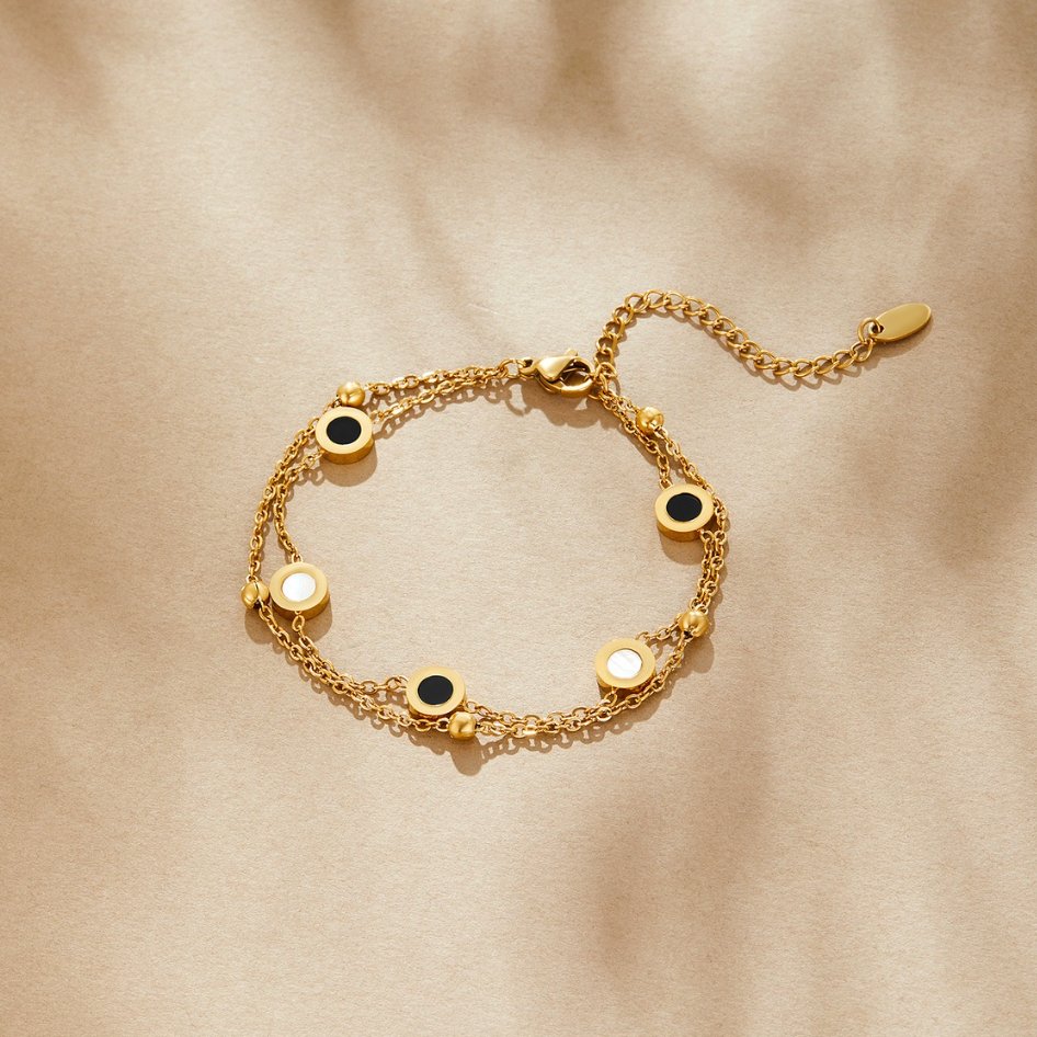 Carla – Elegant Gold Bracelet Featuring Contrasting Round Accents