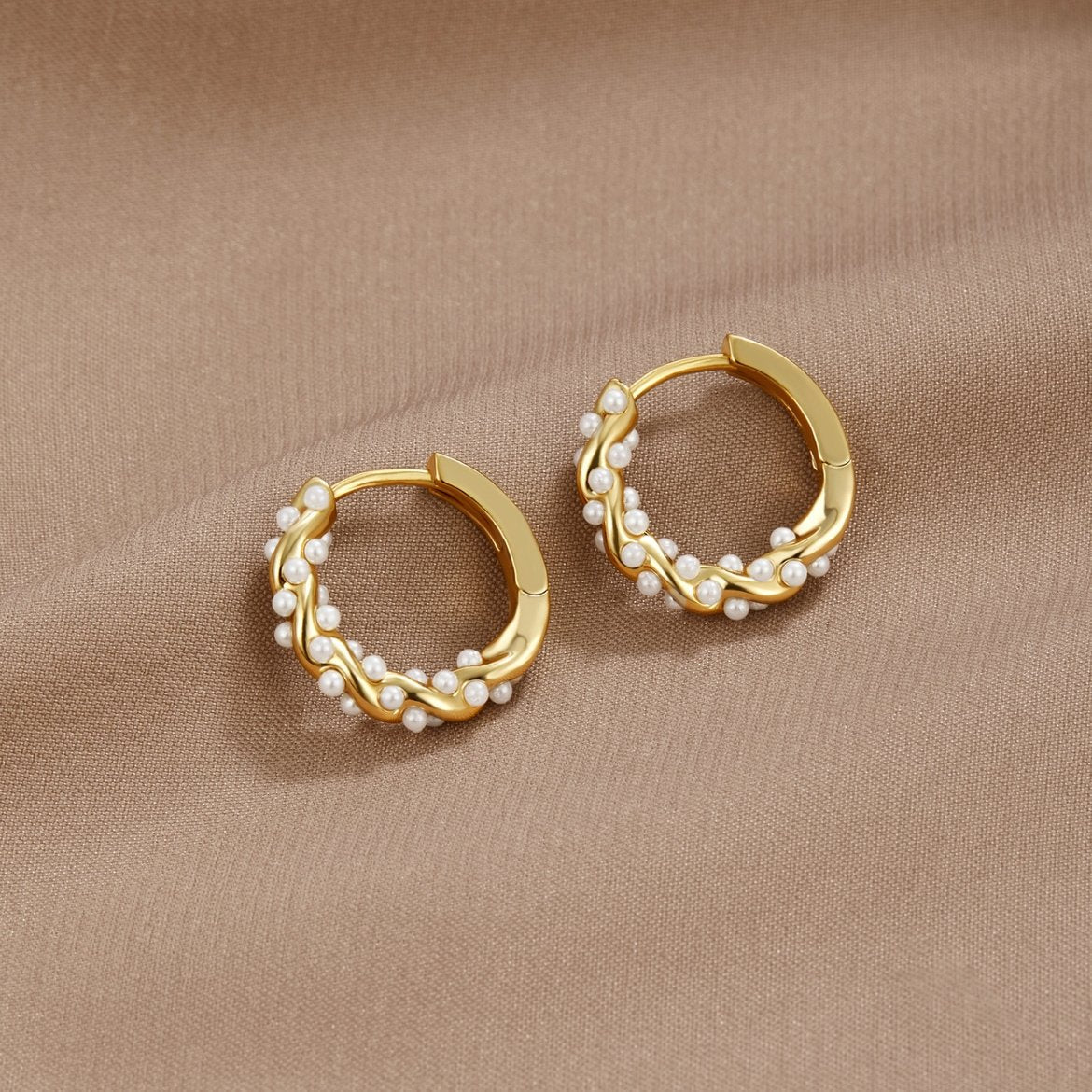 Vale Pearl Hoop Earrings" can be rewritten as "Vale Pearl-Embellished Hoop Earrings.