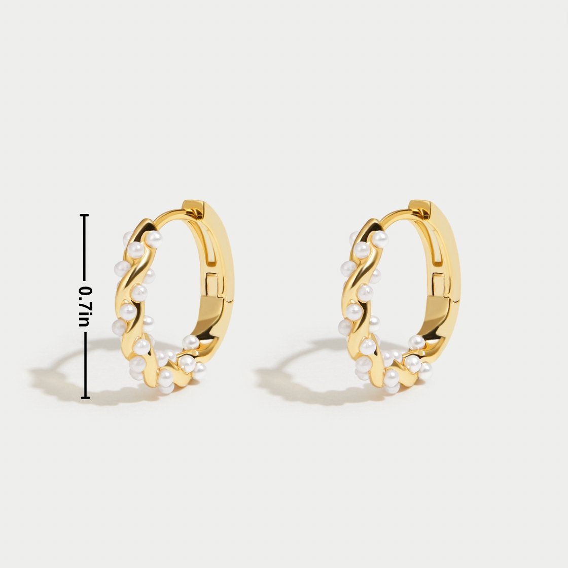 Vale Pearl Hoop Earrings" can be rewritten as "Vale Pearl-Embellished Hoop Earrings.