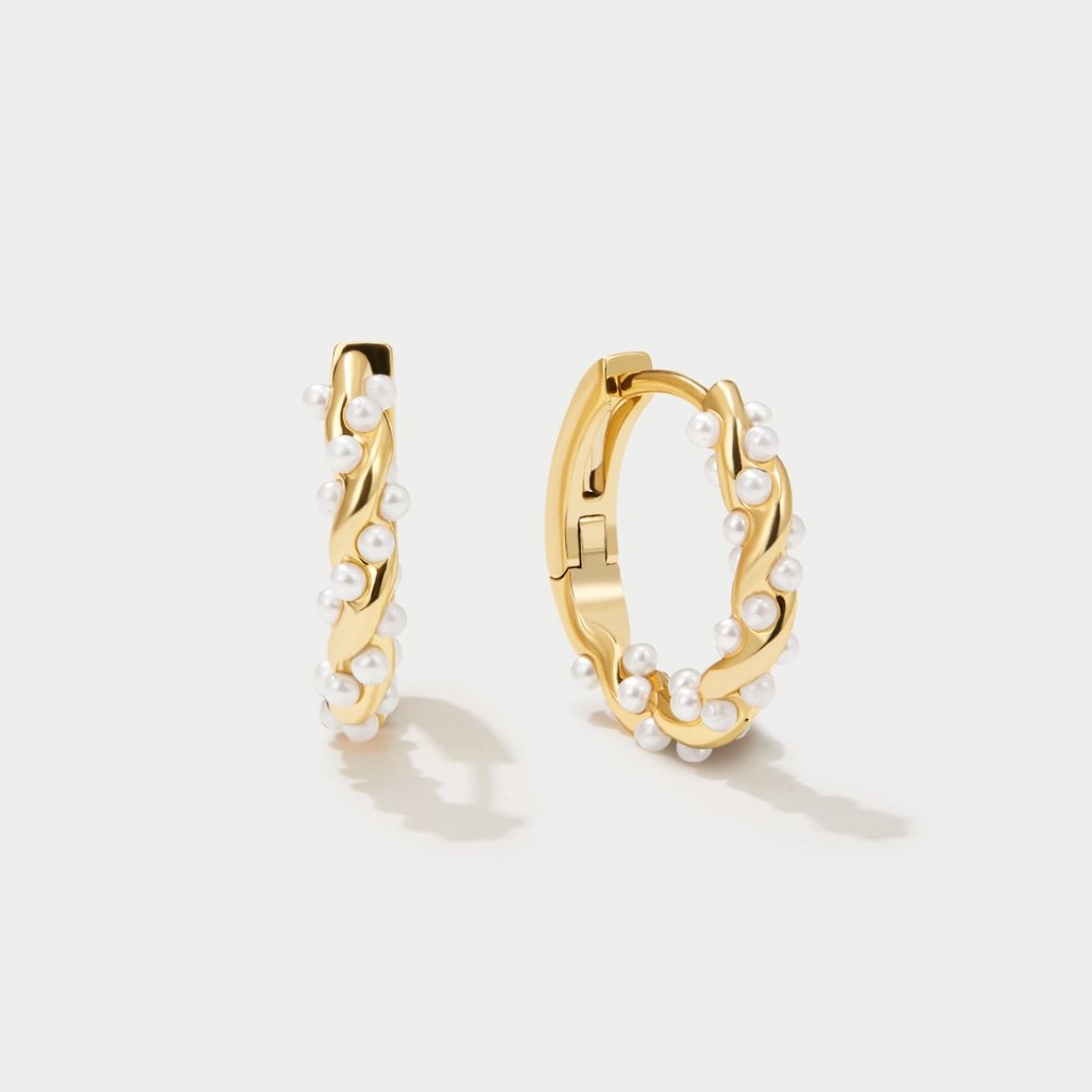 Vale Pearl Hoop Earrings" can be rewritten as "Vale Pearl-Embellished Hoop Earrings.
