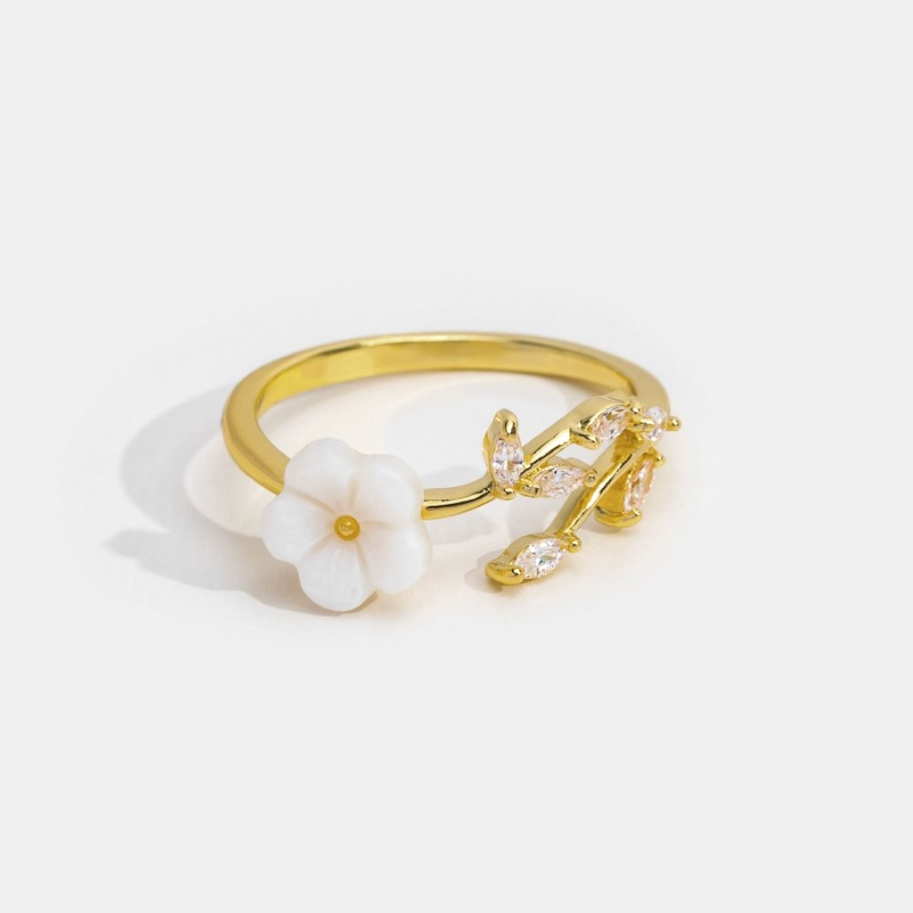 Miriam – Gold Ring Adorned with White Floral Design