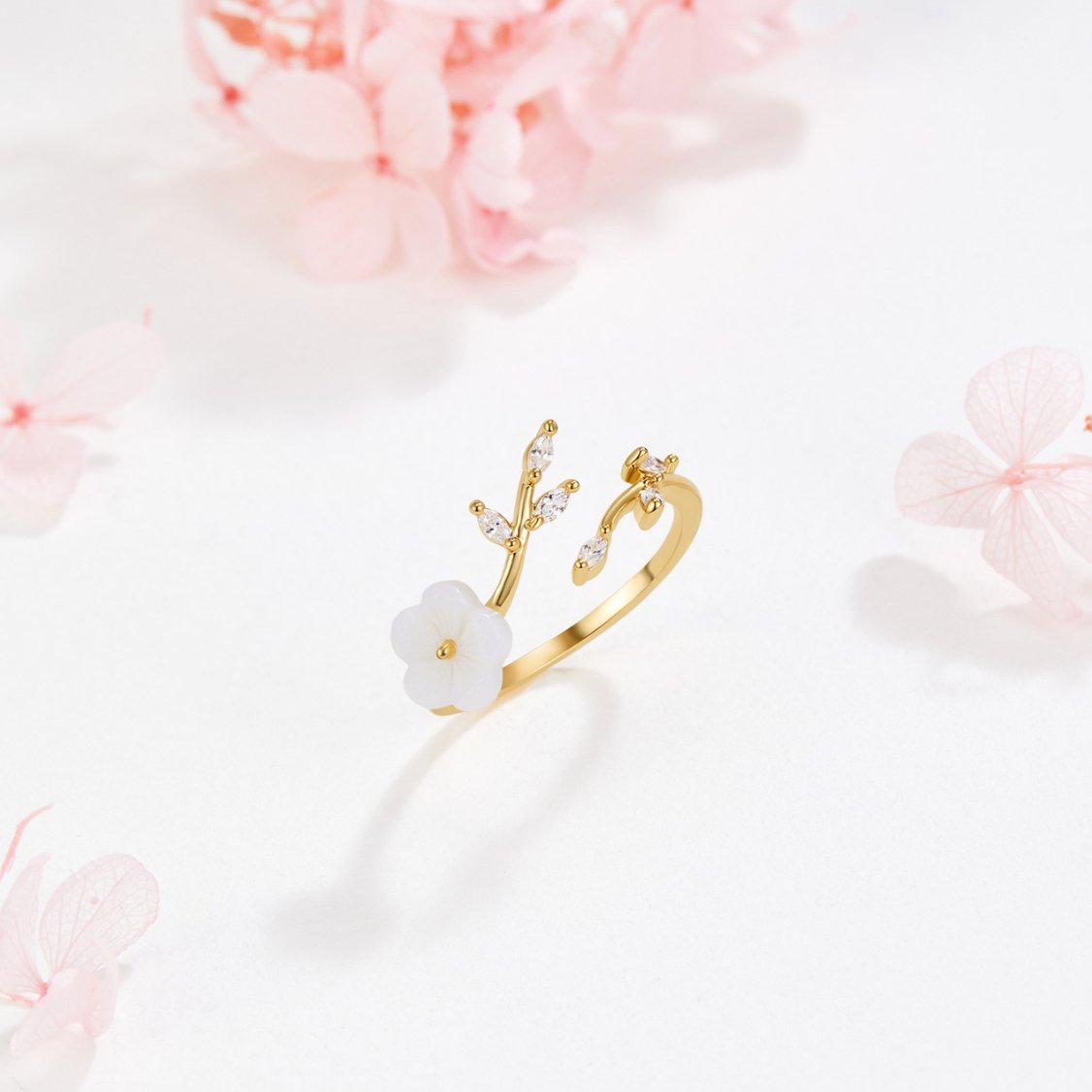 Miriam – Gold Ring Adorned with White Floral Design
