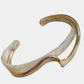 Chic Gold Bracelet Adorned with White Opal